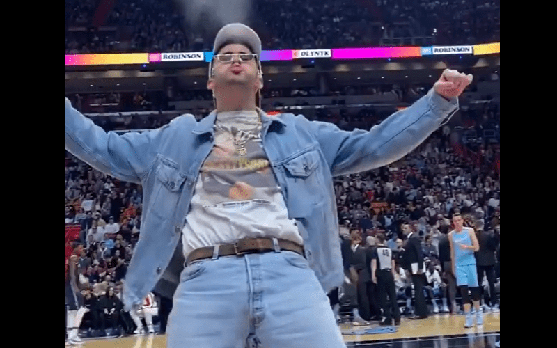 Bad Bunny Hears Triple H's Entrance Song and Does Water Spit at Heat Game, Bad  Bunny went full Triple H on the Miami Heat floor 🤣, By Bleacher Report